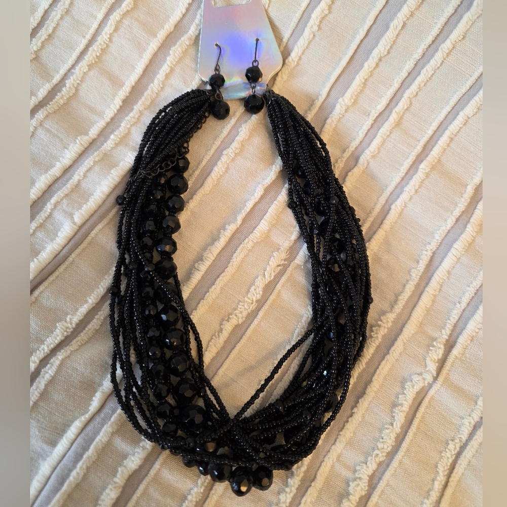 Black multi-strand beaded necklace and matching earrings